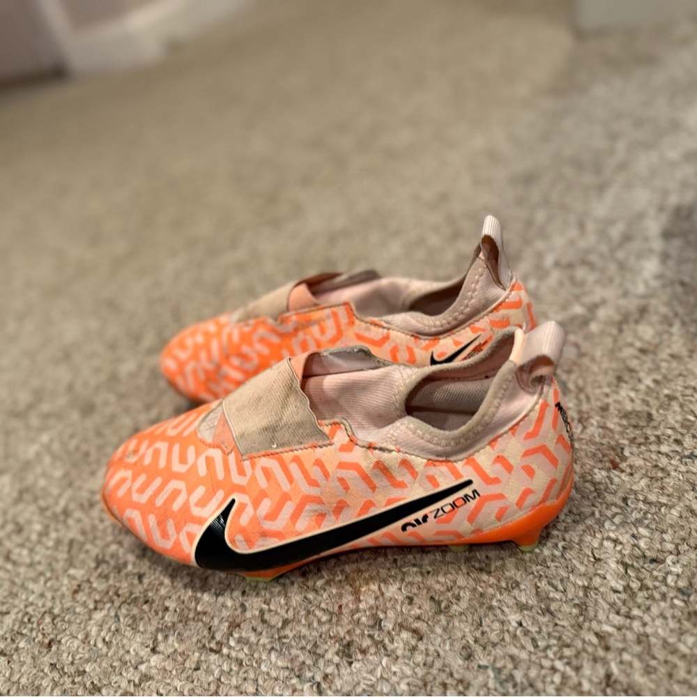 Nike Orange and Black cleats with Sleek Design